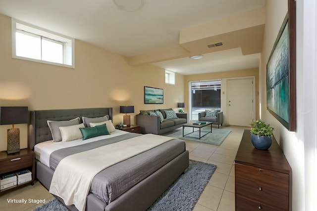 bedroom with light tile patterned flooring and visible vents