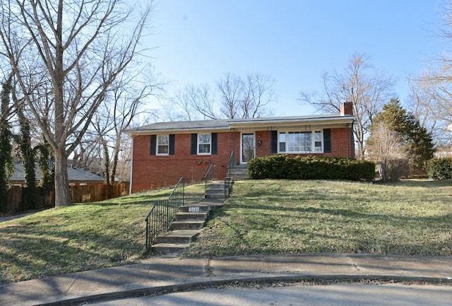 single story home with brick siding, a chimney, a front lawn, and fence