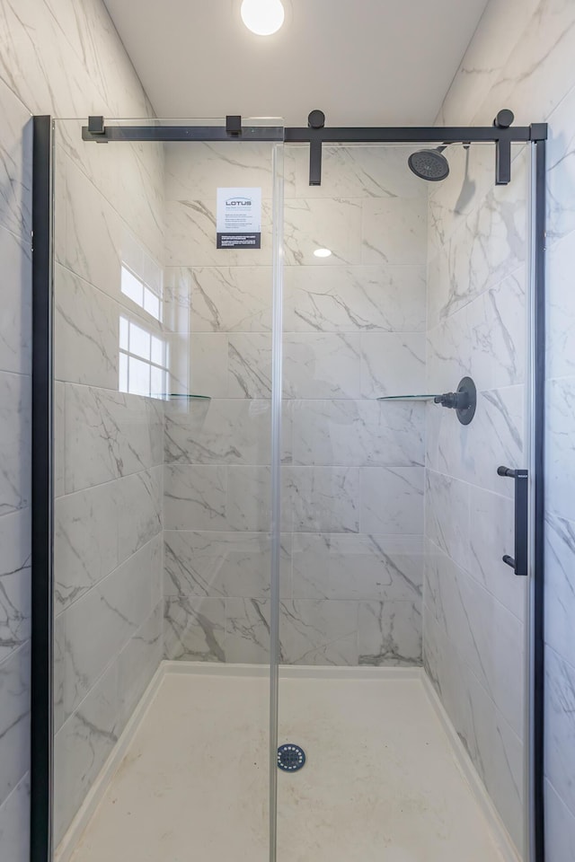 bathroom with a shower stall