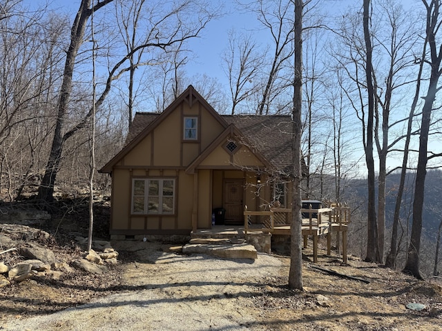 view of front facade featuring roof with shingles