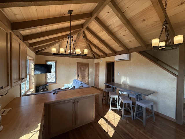 kitchen with an AC wall unit, lofted ceiling with beams, dark wood-style floors, an inviting chandelier, and a textured wall