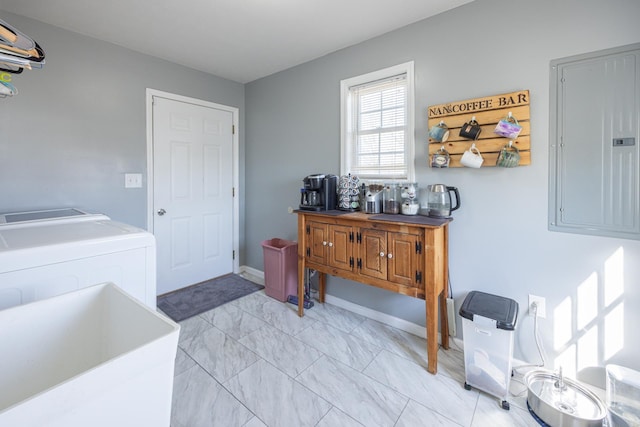 clothes washing area with baseboards, laundry area, electric panel, marble finish floor, and washer and clothes dryer