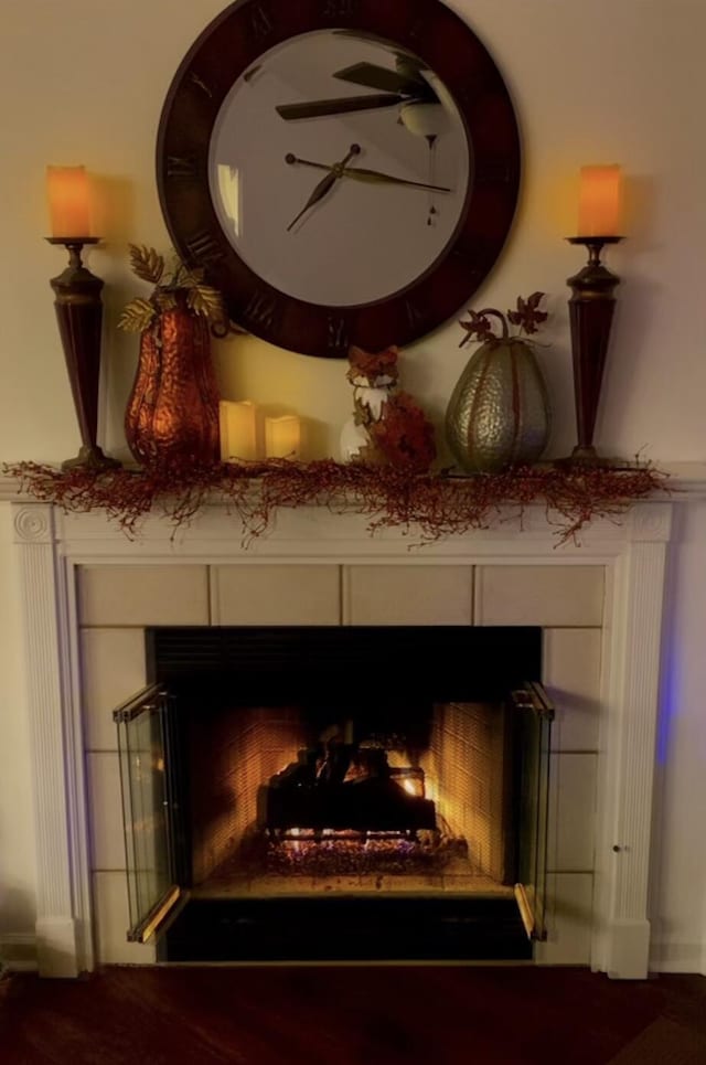 details with a lit fireplace