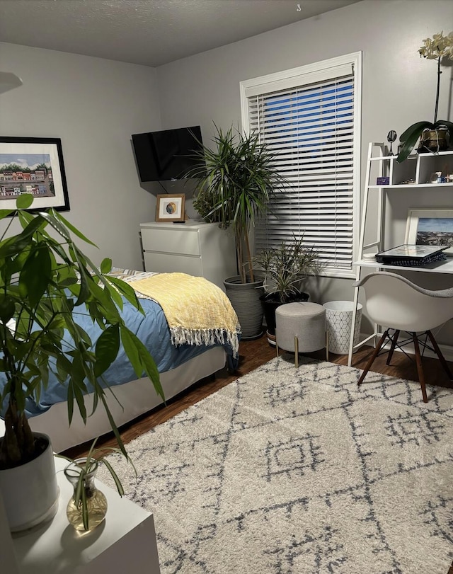 bedroom featuring wood finished floors