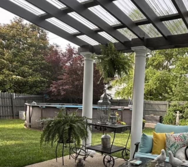 view of patio / terrace featuring a fenced in pool, fence, and a pergola