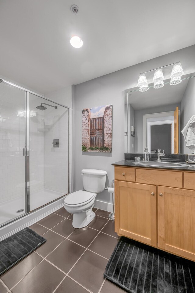 clothes washing area featuring stacked washer and clothes dryer, wood finished floors, and laundry area