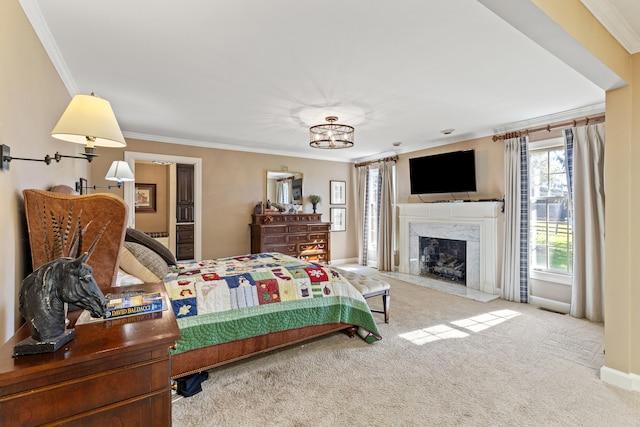 bedroom featuring crown molding, carpet, baseboards, and a high end fireplace