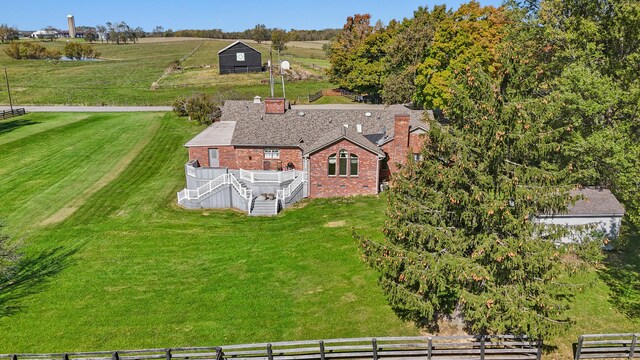 birds eye view of property with a rural view