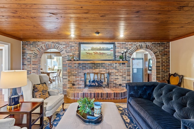 living room featuring arched walkways and wooden ceiling