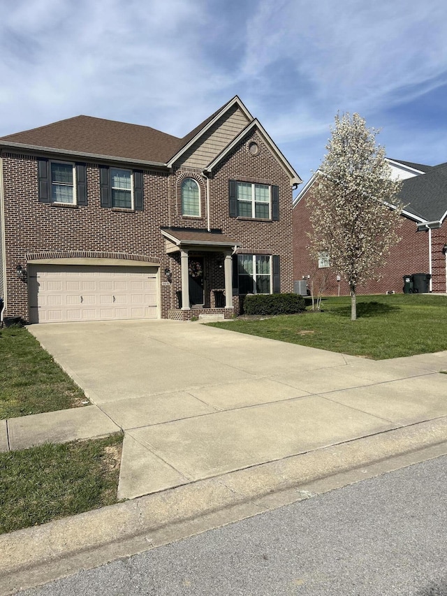 view of front of home featuring a garage, brick siding, concrete driveway, and a front yard