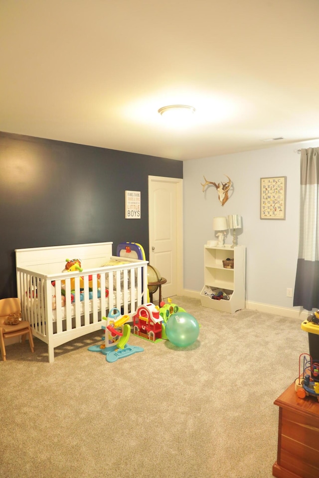 bedroom with baseboards and carpet flooring