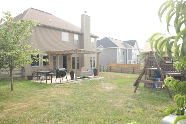 rear view of house with a patio, a playground, a yard, and a pergola