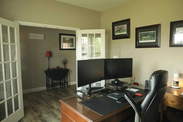 office area with dark wood finished floors and baseboards