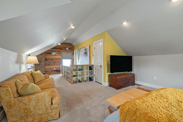 bedroom with lofted ceiling, carpet, and baseboards