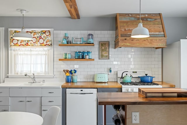 kitchen featuring decorative backsplash, white appliances, beam ceiling, and butcher block counters