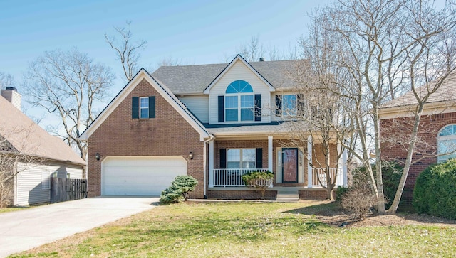 traditional home featuring brick siding, a porch, a front yard, a garage, and driveway