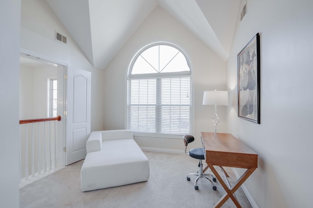 home office with visible vents, lofted ceiling, baseboards, and carpet flooring