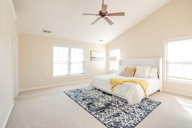 bedroom with visible vents, baseboards, ceiling fan, carpet flooring, and high vaulted ceiling