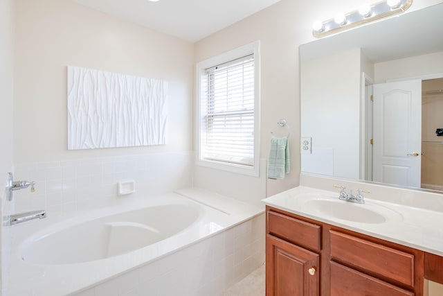 full bathroom featuring vanity and a garden tub