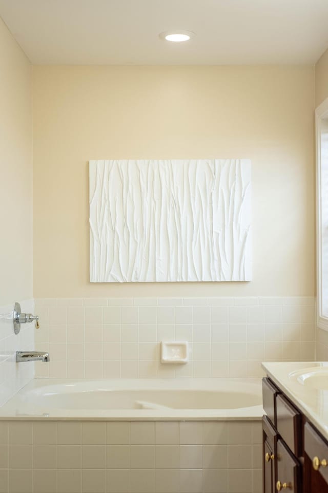 bathroom with a bath and vanity