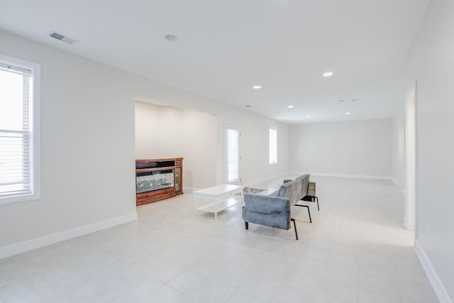 sitting room with recessed lighting, visible vents, and baseboards