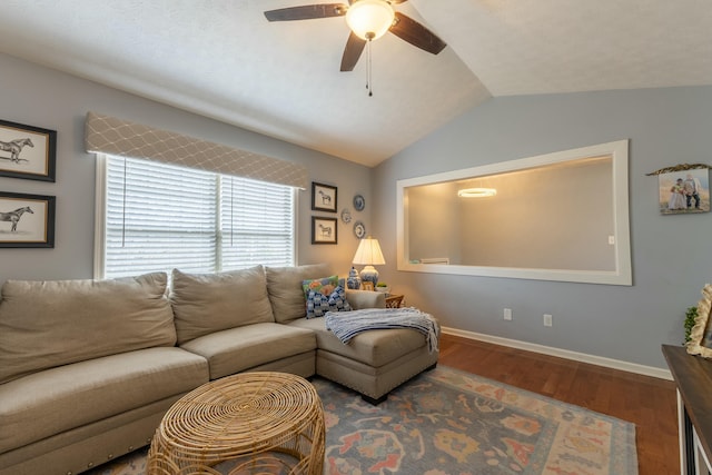 living room with ceiling fan, baseboards, lofted ceiling, and wood finished floors