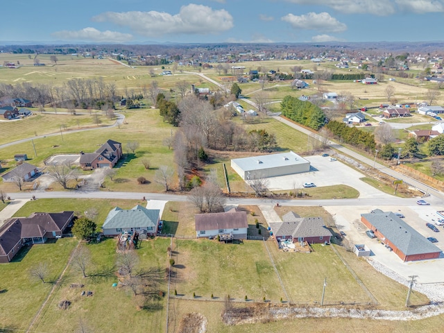 birds eye view of property with a rural view and a residential view