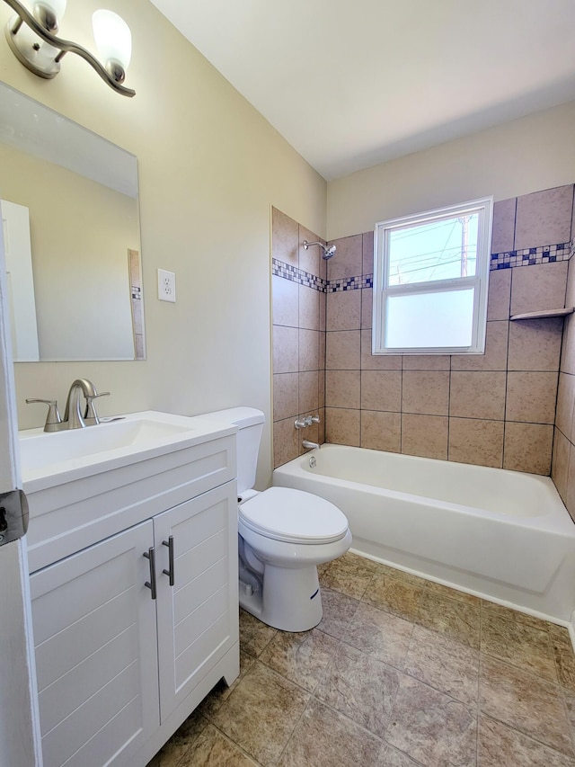 bathroom featuring shower / tub combination, vanity, and toilet