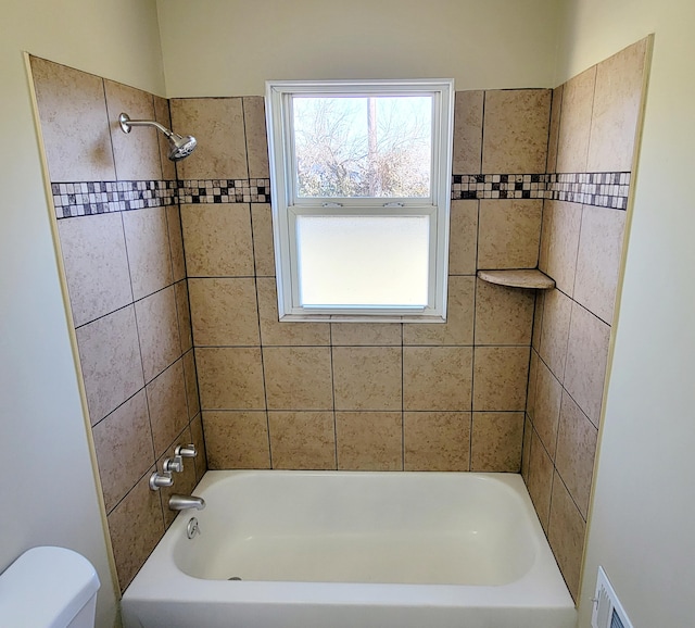 full bathroom with toilet, tub / shower combination, and visible vents