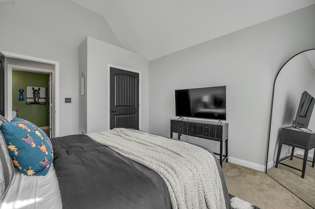 bedroom featuring carpet flooring, baseboards, and lofted ceiling