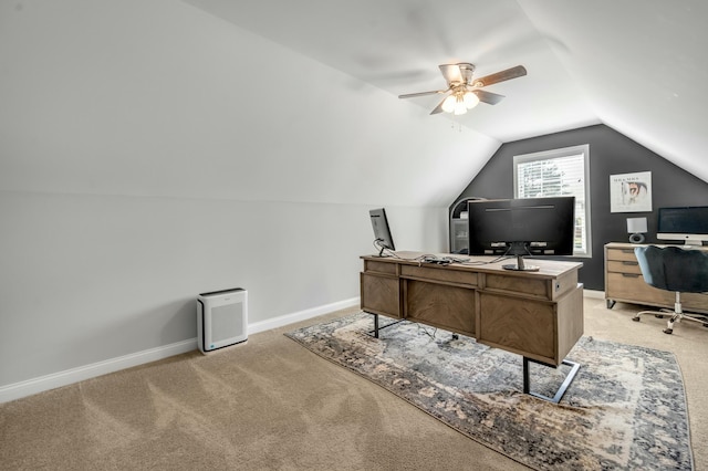 office with vaulted ceiling, a ceiling fan, baseboards, and light carpet