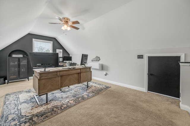 office with baseboards, light colored carpet, a ceiling fan, and vaulted ceiling