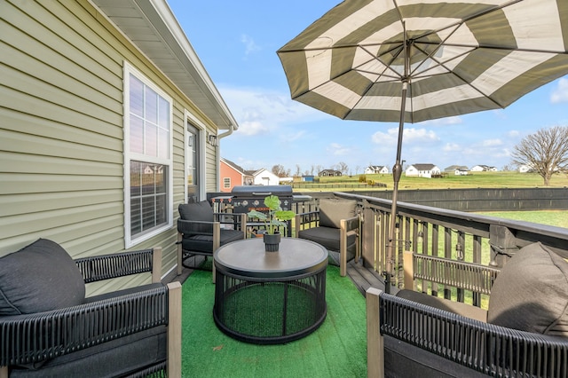 wooden deck with grilling area