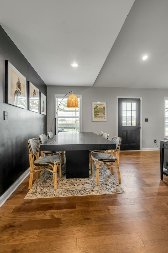 dining area with recessed lighting, baseboards, and wood finished floors