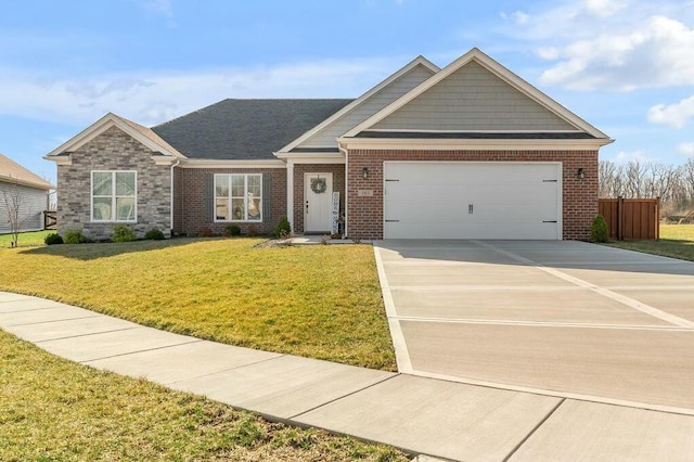 craftsman-style house featuring fence, driveway, a front lawn, a garage, and brick siding