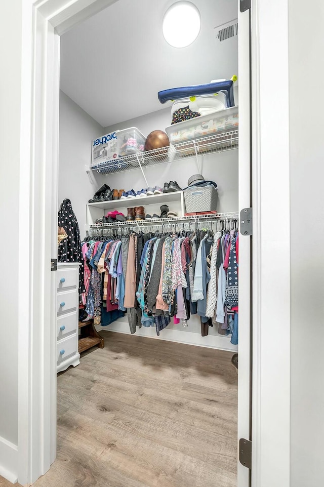 spacious closet with wood finished floors