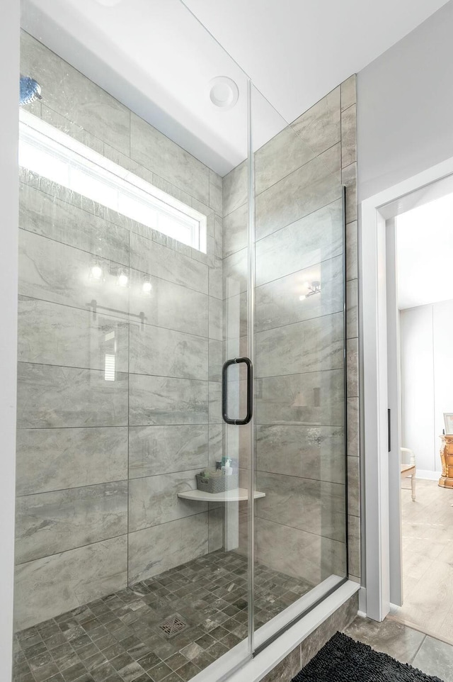 full bath with a shower stall