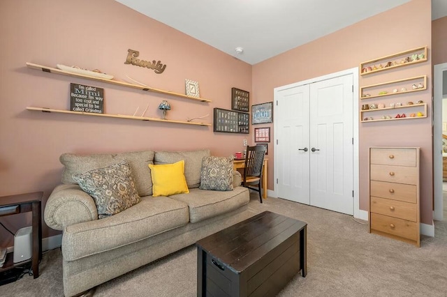 living room with baseboards and carpet flooring