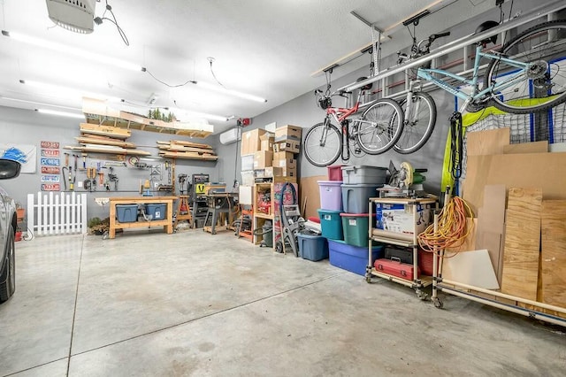 garage featuring a workshop area and a garage door opener