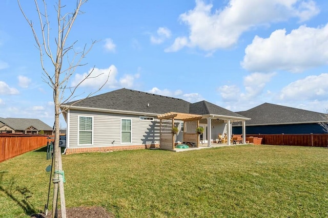 back of property featuring a patio, a fenced backyard, a pergola, a shingled roof, and a lawn