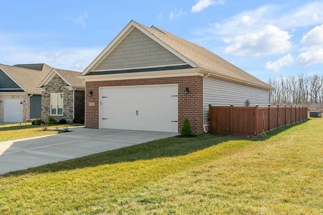 view of front of property featuring fence, concrete driveway, a front lawn, a garage, and brick siding