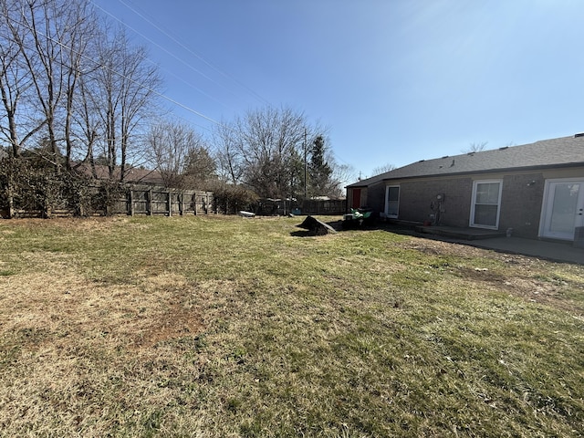 view of yard featuring a patio and fence