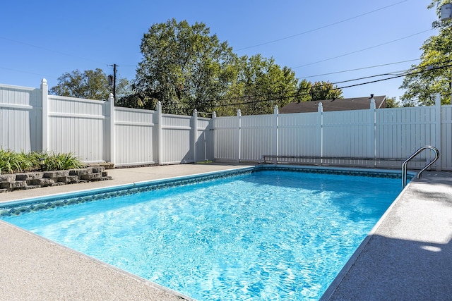 view of swimming pool with fence and a fenced in pool