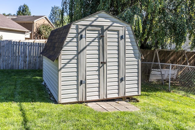 view of shed with a fenced backyard