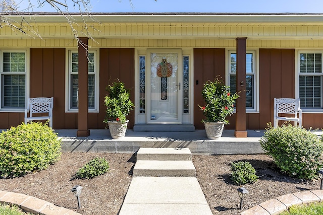 property entrance with a porch and board and batten siding