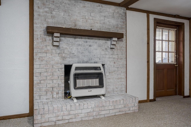 interior details with heating unit, baseboards, and carpet floors