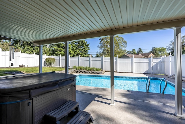 view of pool featuring a patio area, a fenced backyard, a fenced in pool, and a hot tub