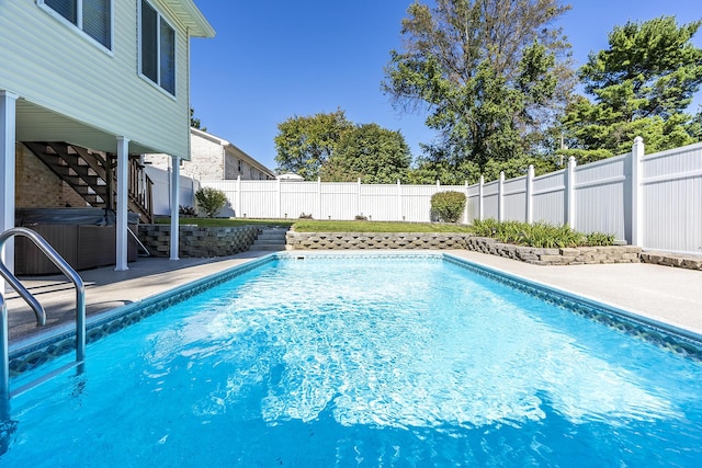 view of pool featuring a fenced in pool, a patio, stairs, and a fenced backyard