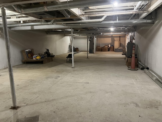 unfinished basement with gas water heater