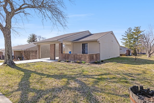 view of front facade with brick siding and a front yard